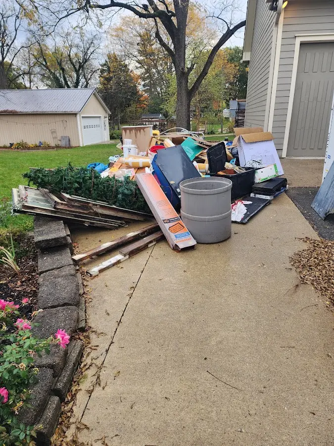 Dumpster being loaded with debris for 3 Yard Dumpster Rental in Homeland Park